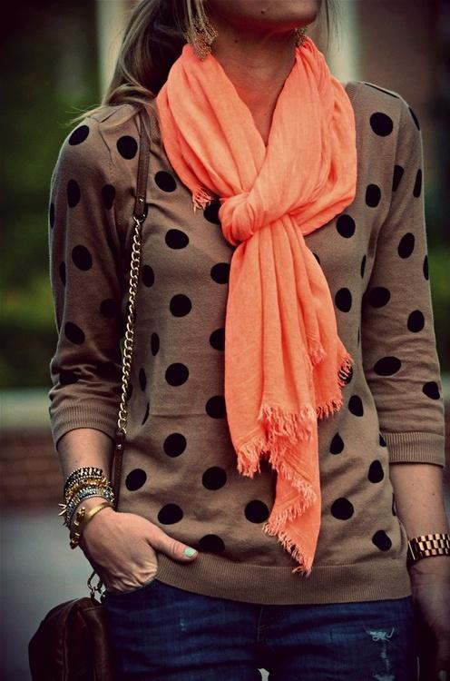 The colored scarf adds a nice hint of color to the neutral colored sweater.