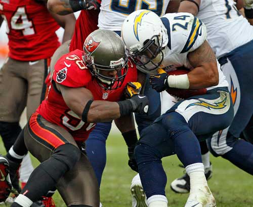 Tampa Bay Buccaneers linebacker Quincy Black (58) collides helmet to helmet with San Diego Chargers running back Ryan Mathews (24) in the third quarter at Raymond James Stadium in Tampa, Florida, Sunday, November 11, 2012. Black left the game on a backboard after a hit. The Tampa Bay Buccaneers defeated the San Diego Chargers, 34-24. 