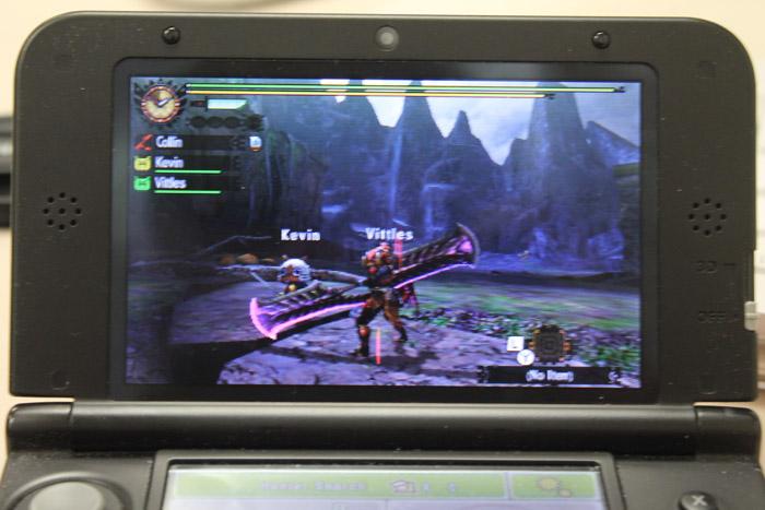 The titular monster hunter along side his two cat companions on a hunt in Capcom's Monster Hunter 4 Ultimate.