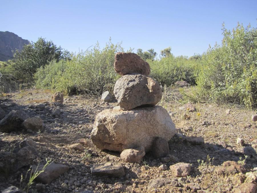 This is a cairn, which are built mainly to act as trail markers. Cairns vary in sizes from tiny (such as this one) to huge piles of rocks. They are also occasionally used for astronomical or even burial purposes. 