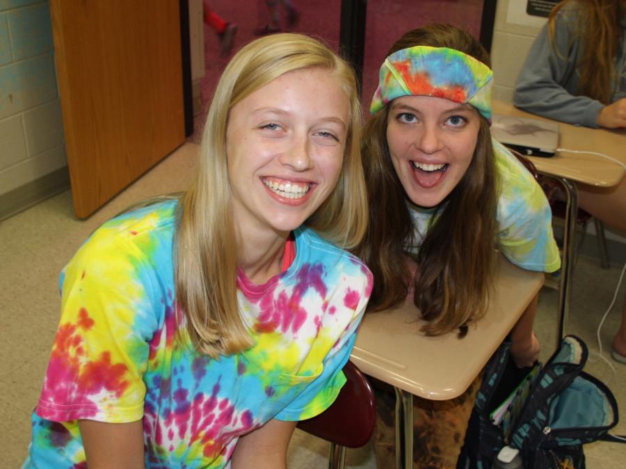 Stacie Harms (12) and Alyssa Gourley (12) smile big in their tie dye in Mr. Suess 7th hour Human Geography test.