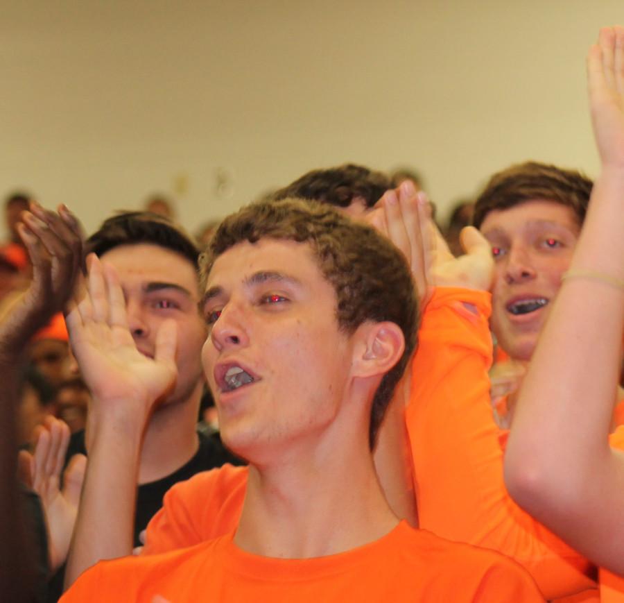 Senior boys getting rallied up at the homecoming assembly.