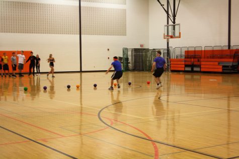 The game started and the first to reach the dodgeball's were Brady Lay(11) and Philip Fazio(11) of Mrs. Lopez team.