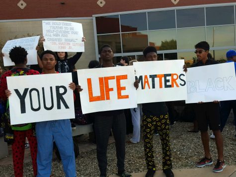 Students gather outside of the front of Normal Community, staging a rally Wednesday morning. 