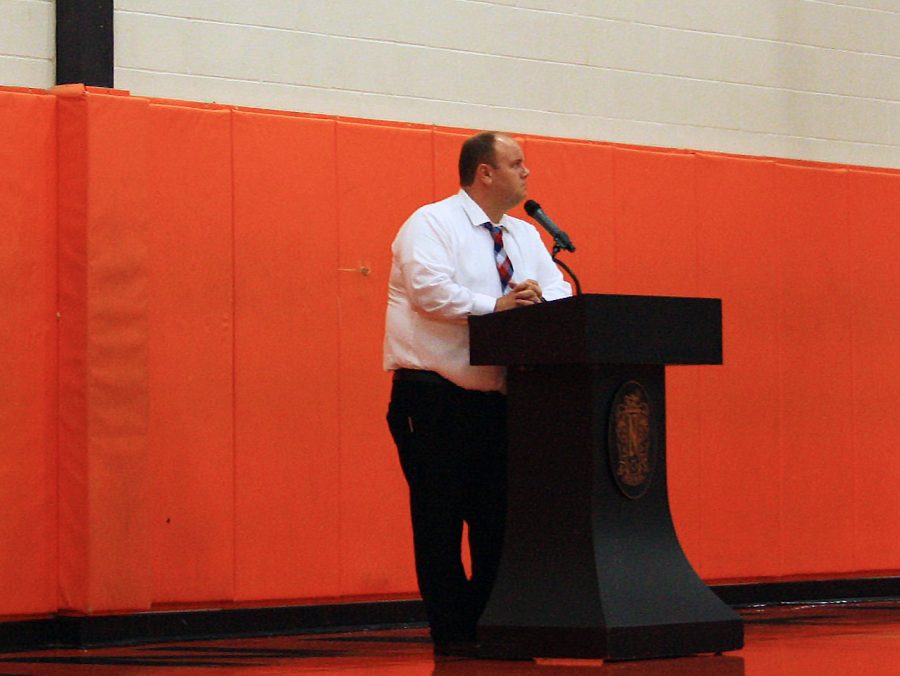 Mr. Trevor Chapman, after Mr. Dave Bollmanns retirement, addresses the student body during the all school assembly. Chapmans duties as NCHS principal began during the summer, but this was his first day as NCHS principal with students in attendance. 