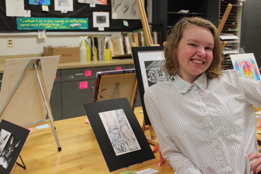 Advanced Art Studio II student, Anabelle Chinski (12) poses with her artwork.