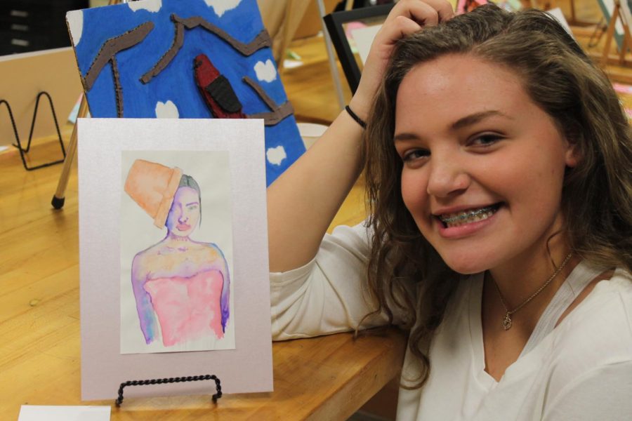 Advanced Art Studio I student, Anna Garner (12) poses with her artwork.