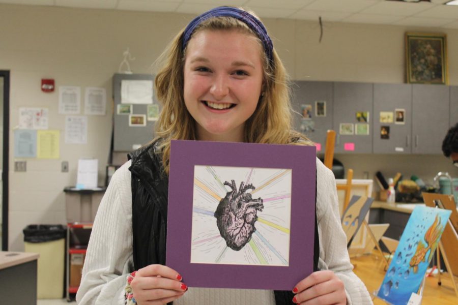 Advanced Art Studio II student, Mollie Brothers (12) poses with her artwork.