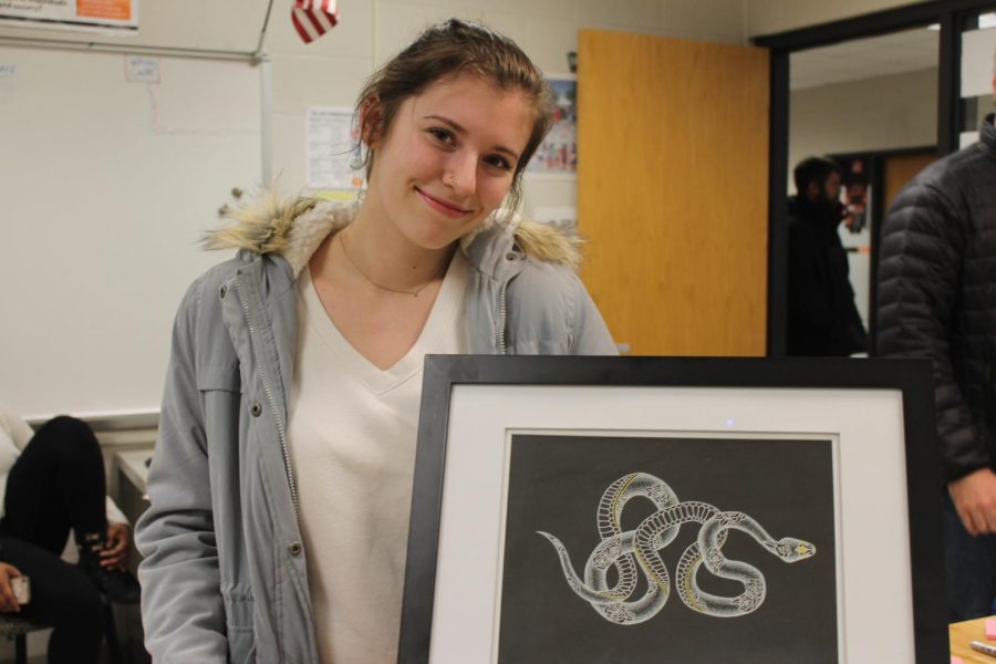 Contemporary Crafts student, Sophia Popejoy (12) poses with her artwork.