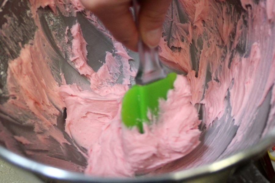 If frosting is too thick, add another tablespoon of water.