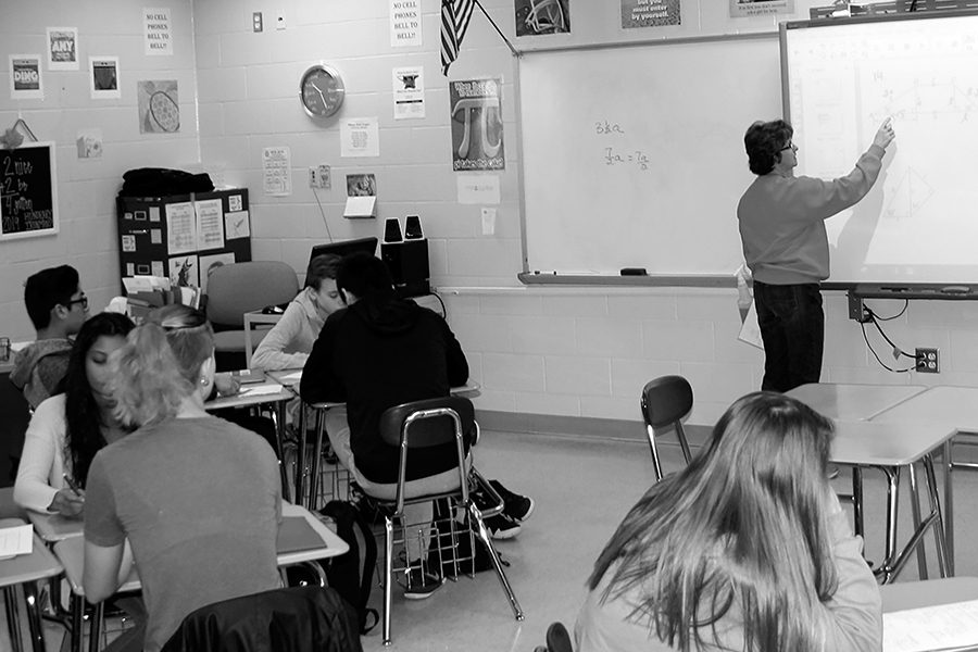 Mrs. Cathe Carter reviews a problem on the SmartBoard in her 3rd hour Honors Geometry class during her last semester teaching at NCHS. 