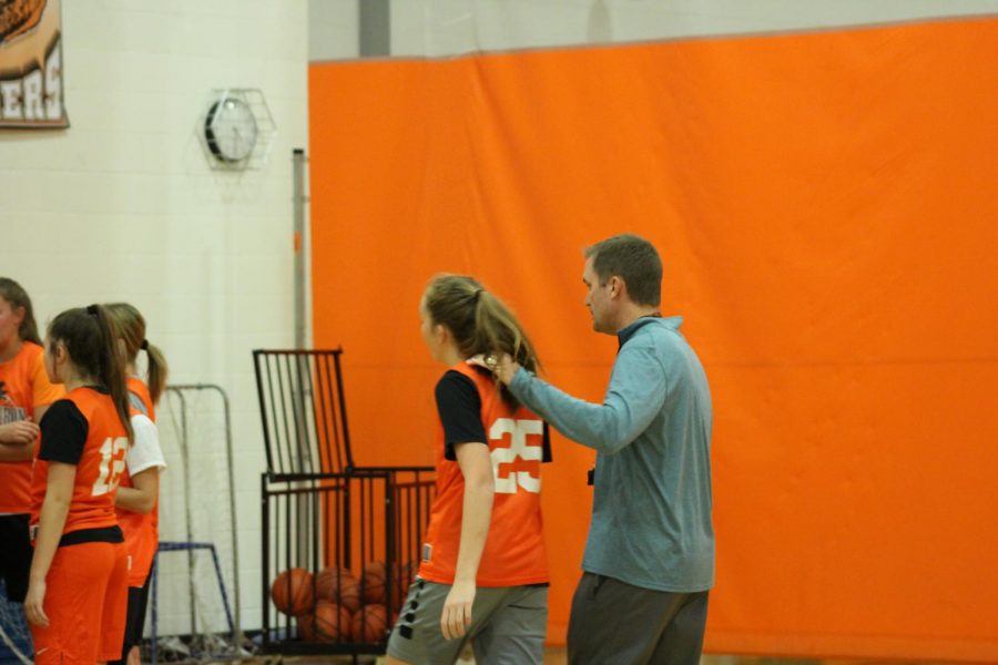 Feeney with then sophomore Maylin Henning during a practice early in the season last year.
