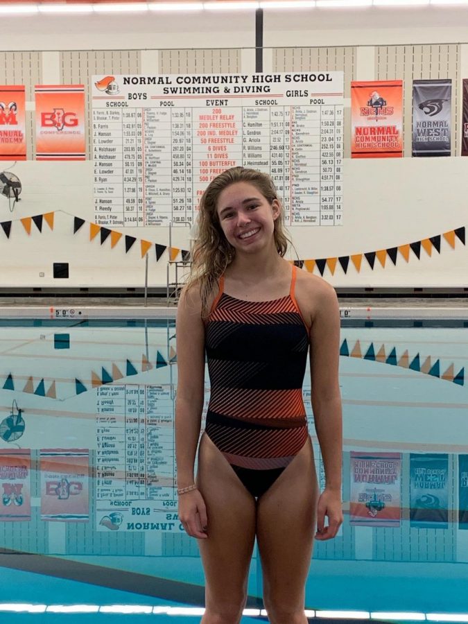 Weber in front of the Iron pool record board after breaking the six dive school record.