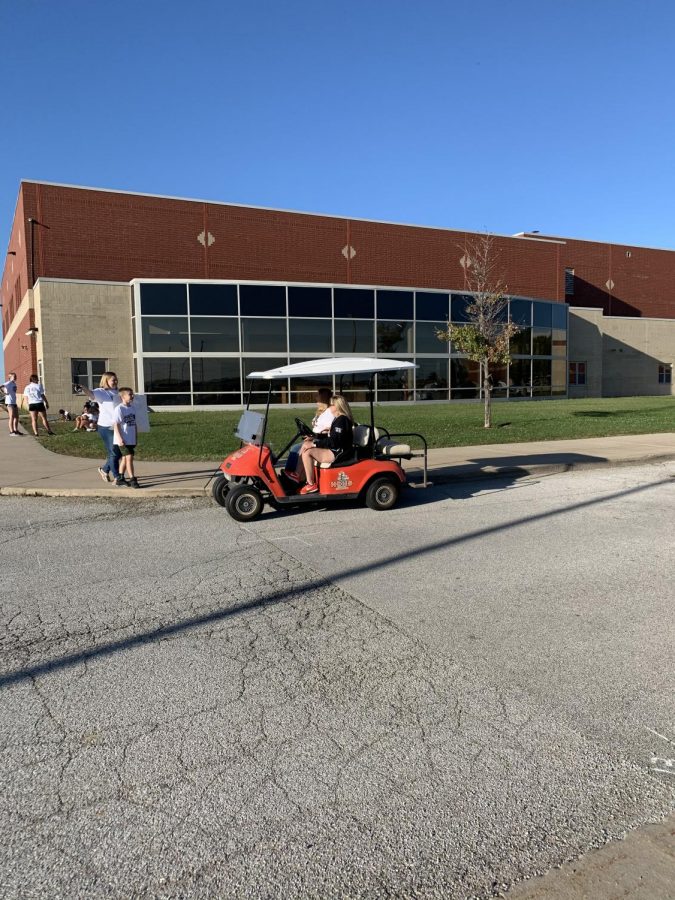 Participants were led by a golf cart on their first lap.