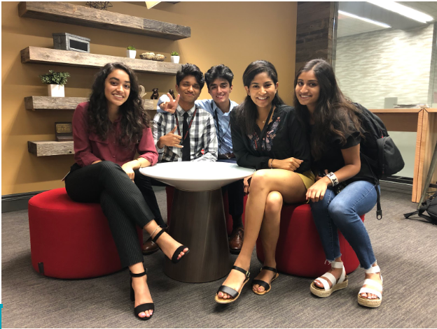 Sivani Sayani (left) and Sunny Shaheen (third from left) collaborate with other interns while developing the framework for the CSHS.