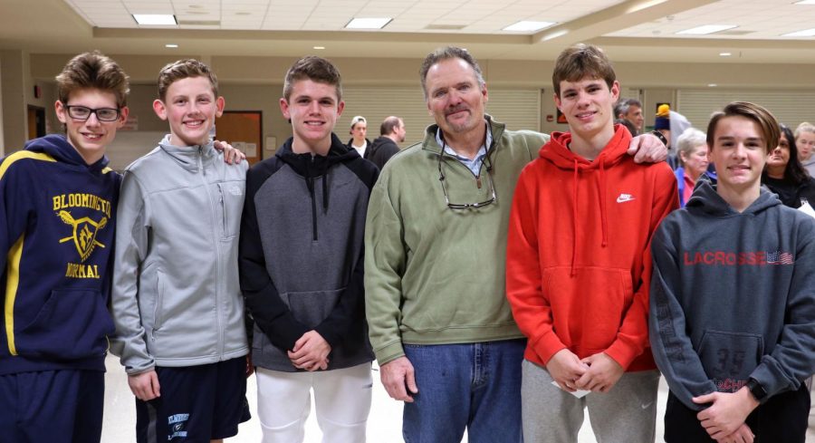 Tom Schniedwind, head coach of the boys varsity and junior varsity lacrosse teams poses with future BNL players.