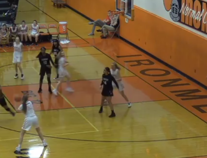 Mallory Oloffson (21) prepares to shoot a three during the third quarter of the Lady Irons loss to Peoria Richwoods. 