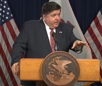 Governor J.B. Pritzker reacts to the IHSAs decision to go forward with high school basketball seasons in a press conference on October 28.