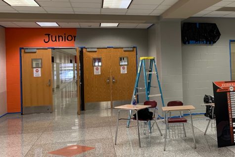 Signage will be added around the building to replace outdated design like the orange and black entrance to the junior hallway.