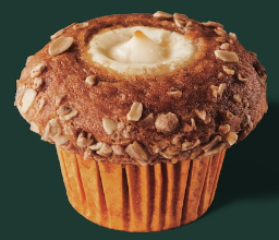 Starbucks describes their fall failure as spiced pumpkin muffin topped with sweet cream cheese filling and a sprinkling of chopped, spiced pepitas.
