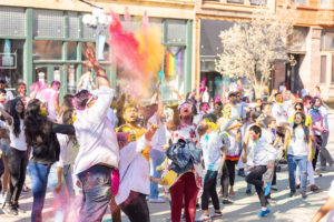 Following Holi traditions, attendees of the April 2023 celebration arrived dressed in white attire. The participants left smeared in the vibrant hues of  colored powder.