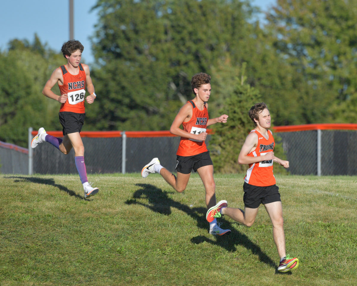 Junior Joey Yaros (center) took second in the boys cross country teams opening meet, posting a 15:52 finish at Maxwell Park on Sept. 1.