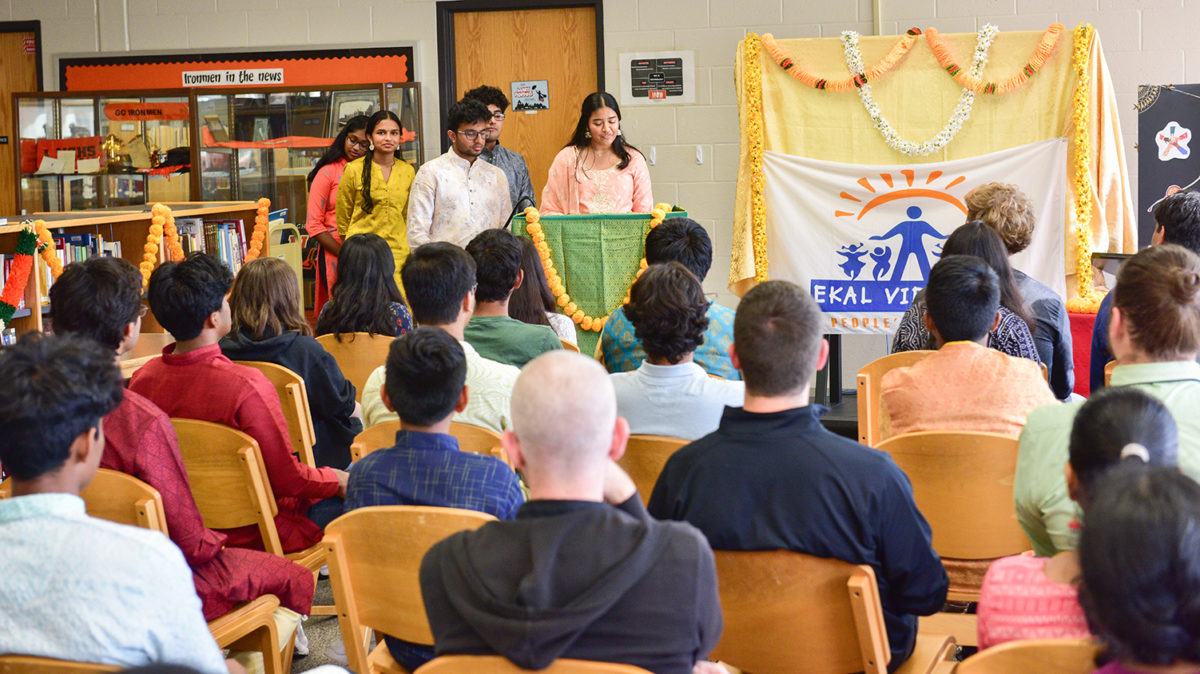 Helping Hands youth board member Pranathi Ganti (’24) addresses the more than 65 students, staff and administrators who attended the Aug. 30 event. 