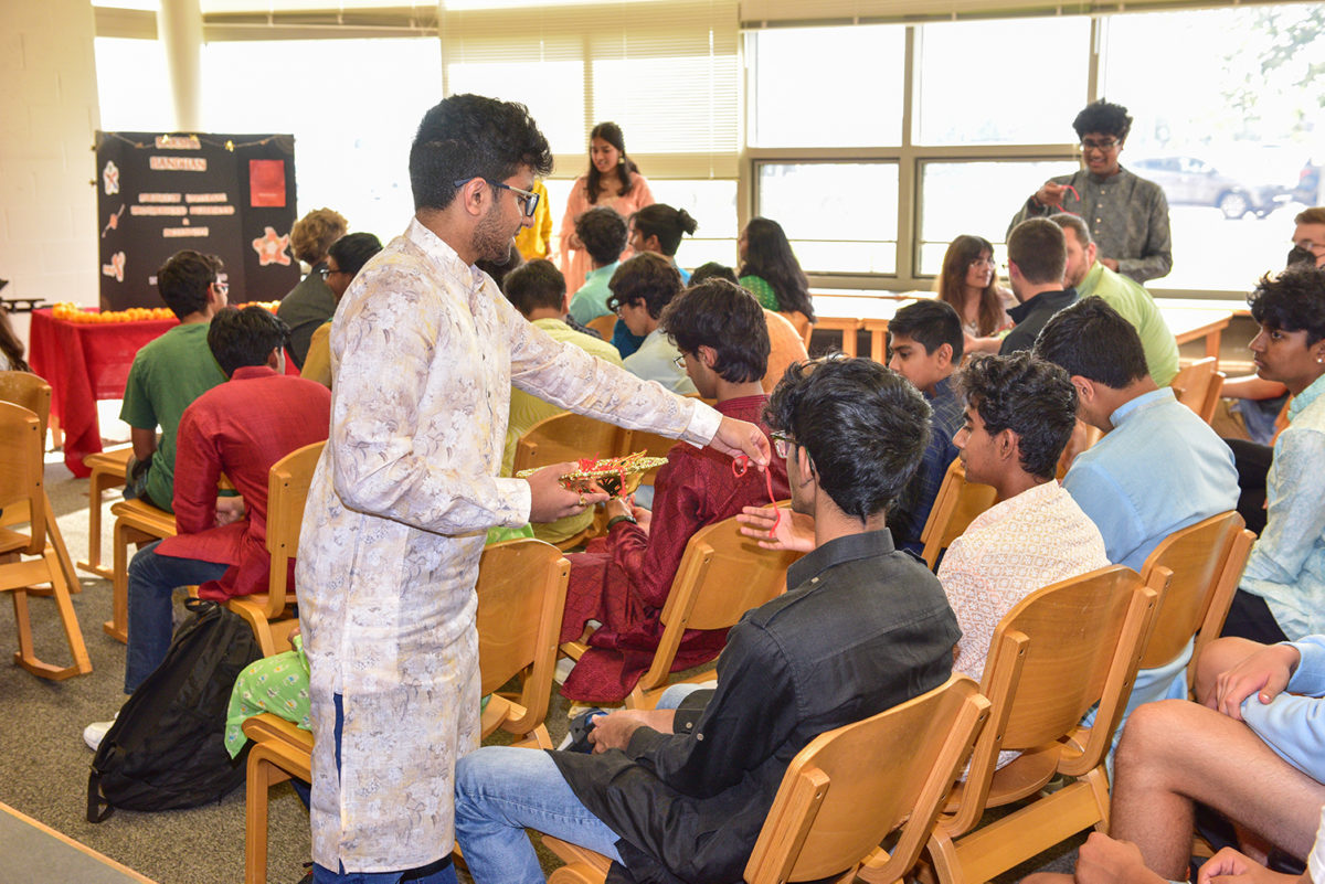 Sophomore Sachi Revuru scoured markets in India for 300 unique handmade rakhi.
Attendees then tied the red-threaded jewelry on other guests’ wrists in homage to the custom among siblings at traditional Raksha Bandhan ceremonies. 
