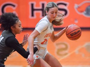 Olivia Corson led Community in scoring in the regional win over Normal West. Six of Corsons 14 points came in the first quarter, helping establish the Irons lead.

Photo Courtesty of: Mr. Jeff Christopherson