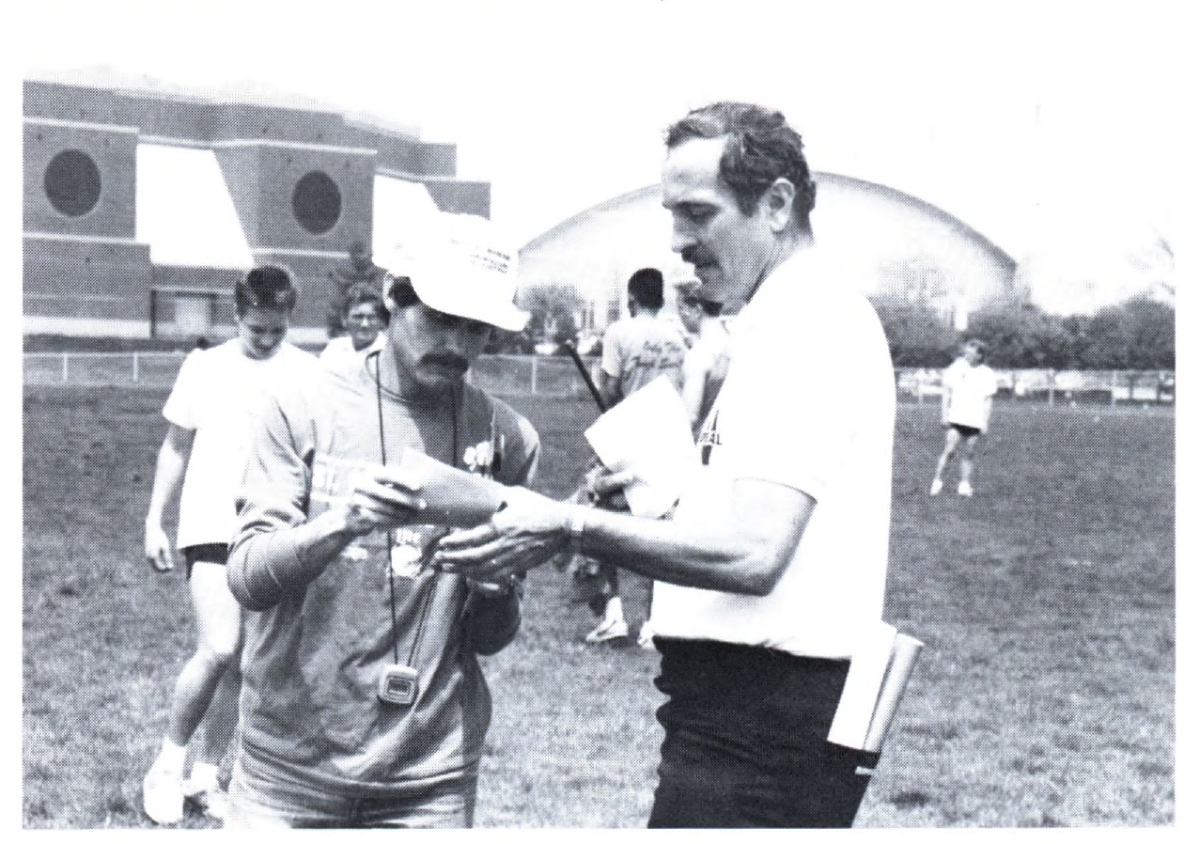 In+1985%2C+Tom+Patten+%28left%29+became+head+coach+of+the+boys+and+girls+cross+country+programs.+%0APatten+served+as+a+boys+track+and+field+assistant+coach+under+Jim+Baker+%28right%29%2C+working+primarily+with+the+distance+runners%2C+before+taking+over+the+boys+program+in+1995.+%0A%0AImage+Courtesy%3A+Reverie+Yearbook