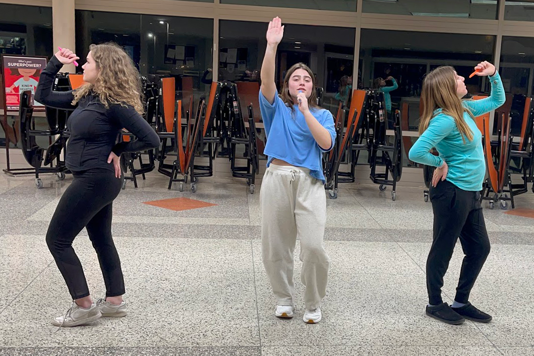 Bailey Kozlen, Lily Mavros and Sophia Hartke step into character as they perfect their electric Donna and the Dynamos routine in the fishbowl. Kozlen stars as Tanya while Hartke portrays Rosie, two of Donna's friends.
Photo Courtesy of: Mrs. Beth Topping