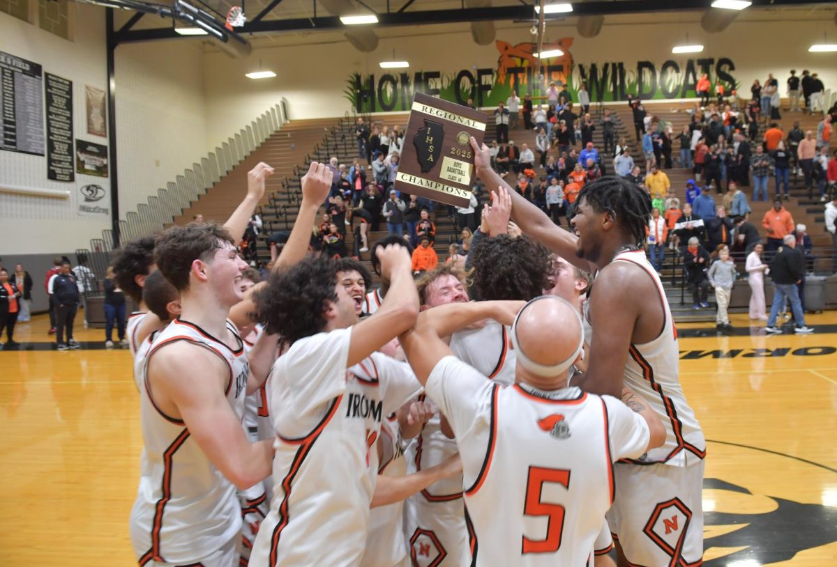 The Ironmen celebrate their historic fifth consecutive regional title after defeating Minooka 51-38. Now they look to avenge their first loss of the season when they face Rock Island in a rematch in the sectional semis.

Photo Courtesy of: Mr. Jeff Christopherson