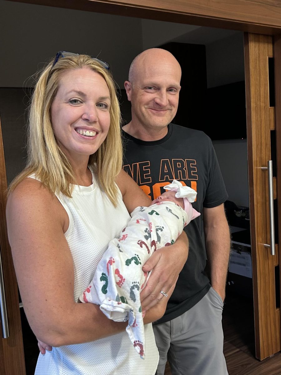 Principal Dr. Adam Zbrozek and his wife hold their first grandchild, Oaklynn Raye Zbrozek, born Monday, Aug. 18, weighing 7 pounds, 7 ounces and measuring 18 inches. 

Zbrozek joked that Oaklynn “already has more hair than me” after driving to Texas for her birth. 
Photo Courtesy of: Dr. Adam Zbrozek 