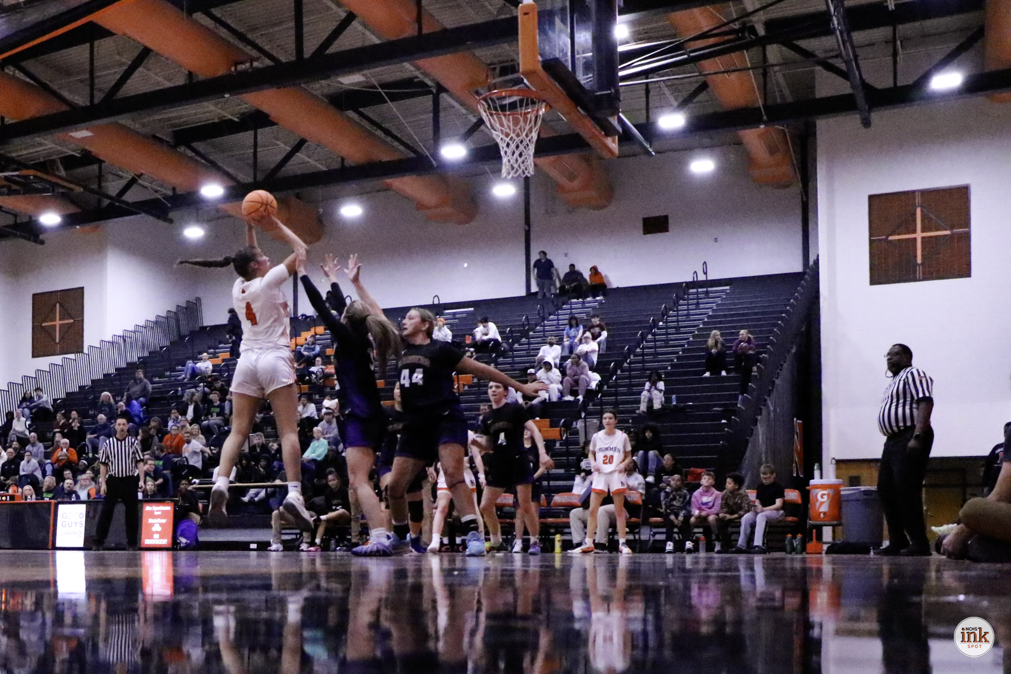 Jocelynn Schilb powers up a short shot in traffic in the second quarter as the Iron trailed the Raiders. Schilb was 6-12 from the field on the night. 