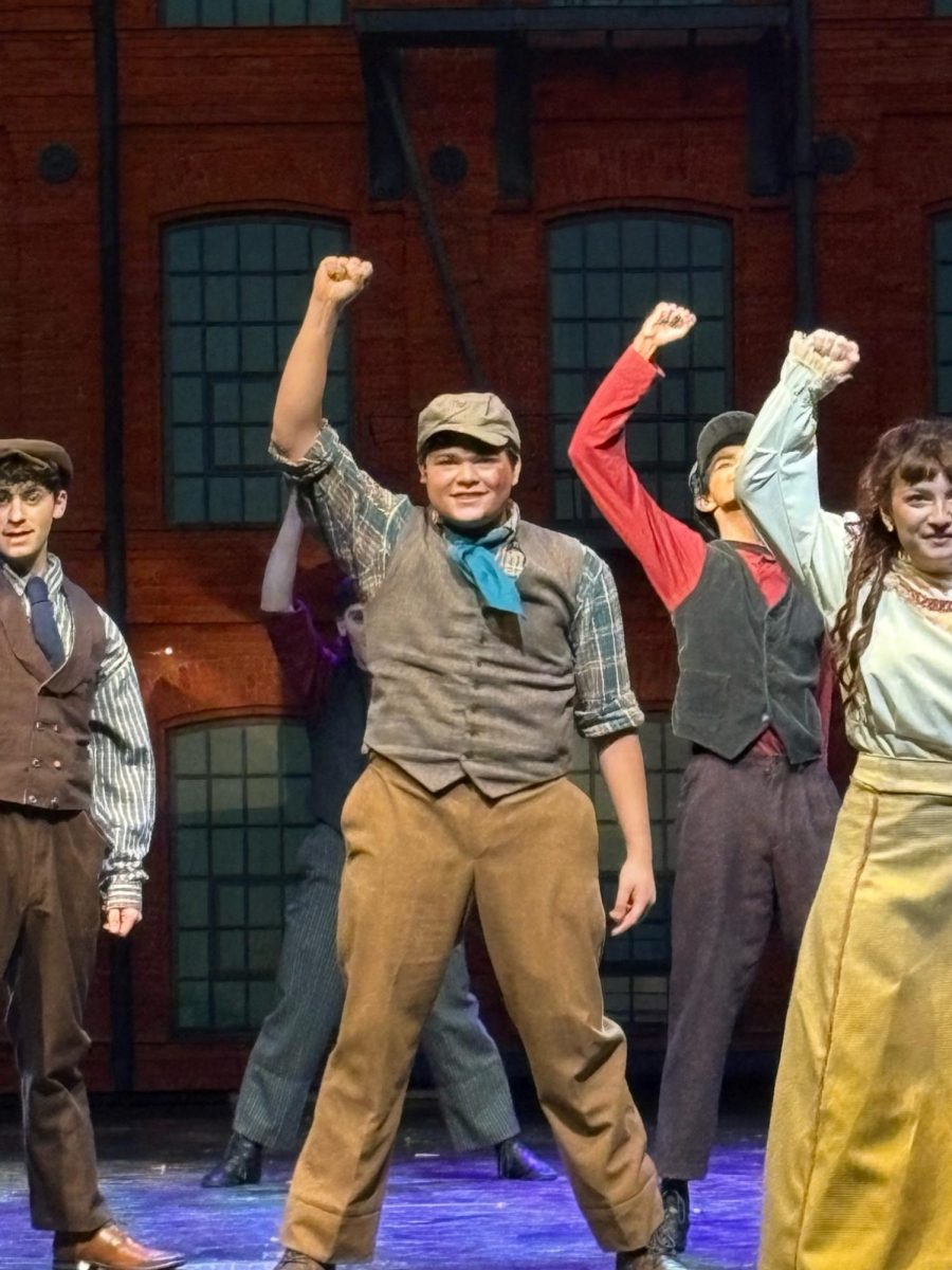 Community's first-ever All-State lead Miguel Patiño-Diaz pumps his fist during the show's final number.  

Photo Courtesy of: Ms. Cassie Adelman