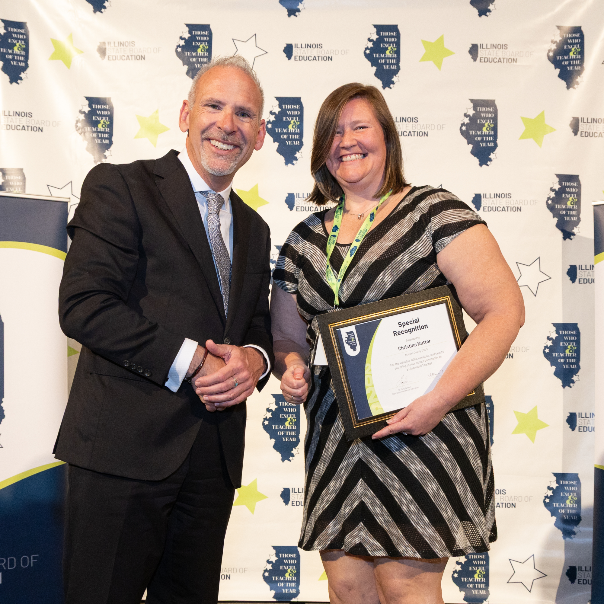 Dr. Tony Sanders, Illinois State Superintendent of Education, presents Ms. Nutter with her Special Recognition awared at the ISBE's Those Who Excel banquet on April 18.
